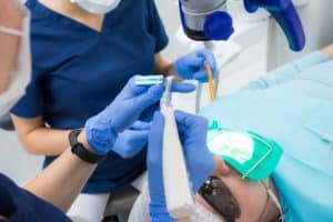 man getting root canal procedure at 21st century dentistry